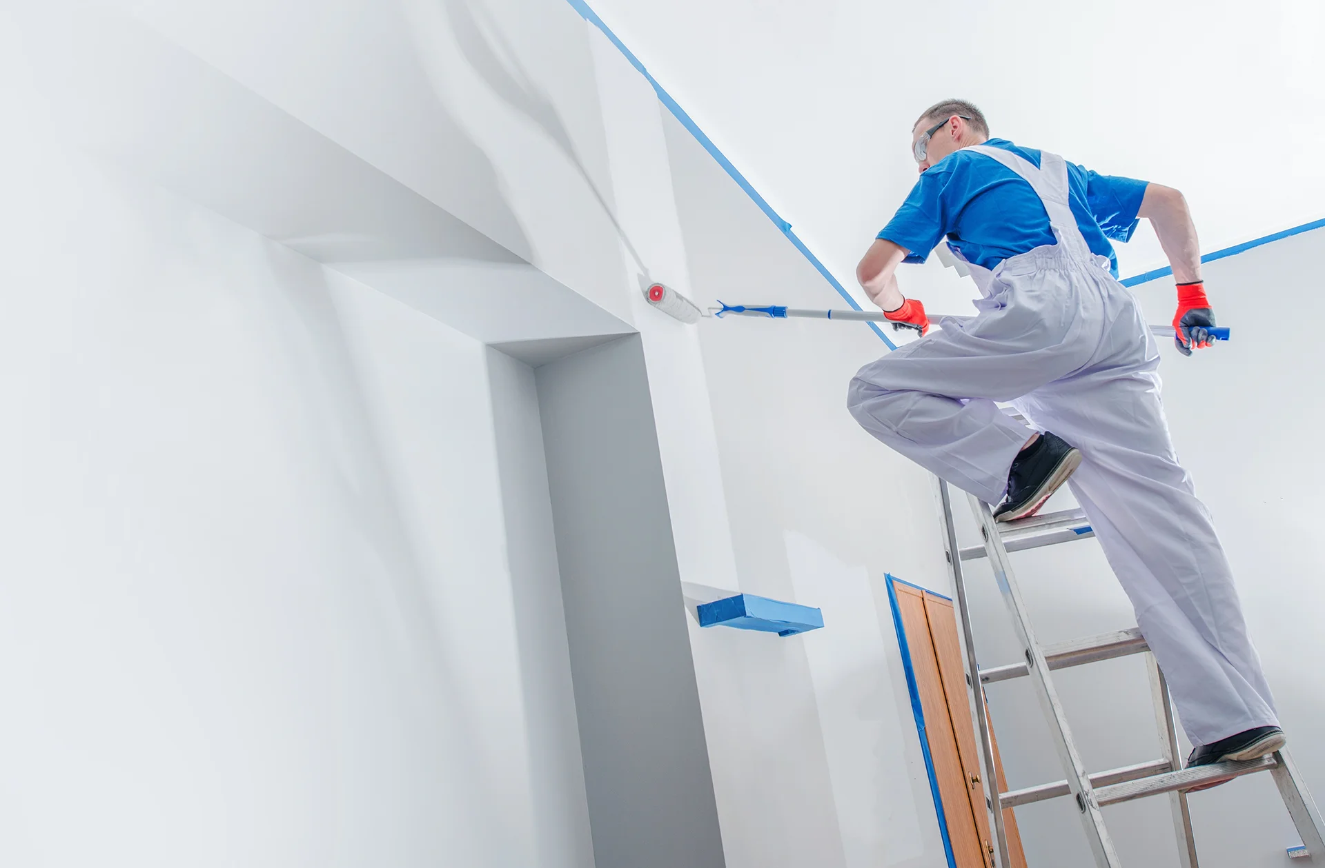 Interior painter on ladder